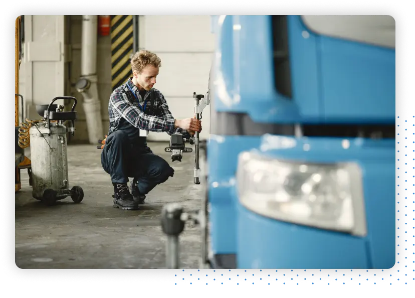 Person performing maintenance on a truck